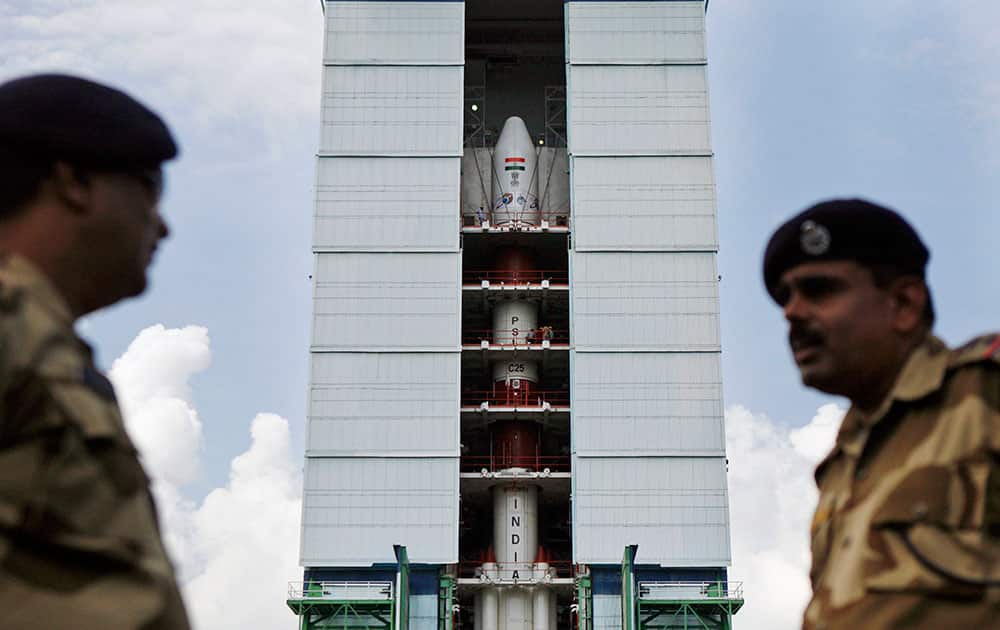 Central Industrial Security Force (CISF) personnel stand guard near the Polar Satellite Launch Vehicle (PSLV – C25) at the Satish Dhawan Space Center at Sriharikota, in the southern Indian state of Andhra Pradesh.