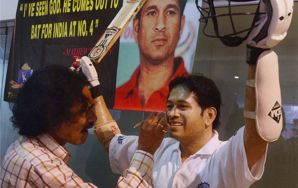 Renowned artist Susanta Roy gives finishing touches to a wax life size statue of Sachin Tendulkar in Kolkata.