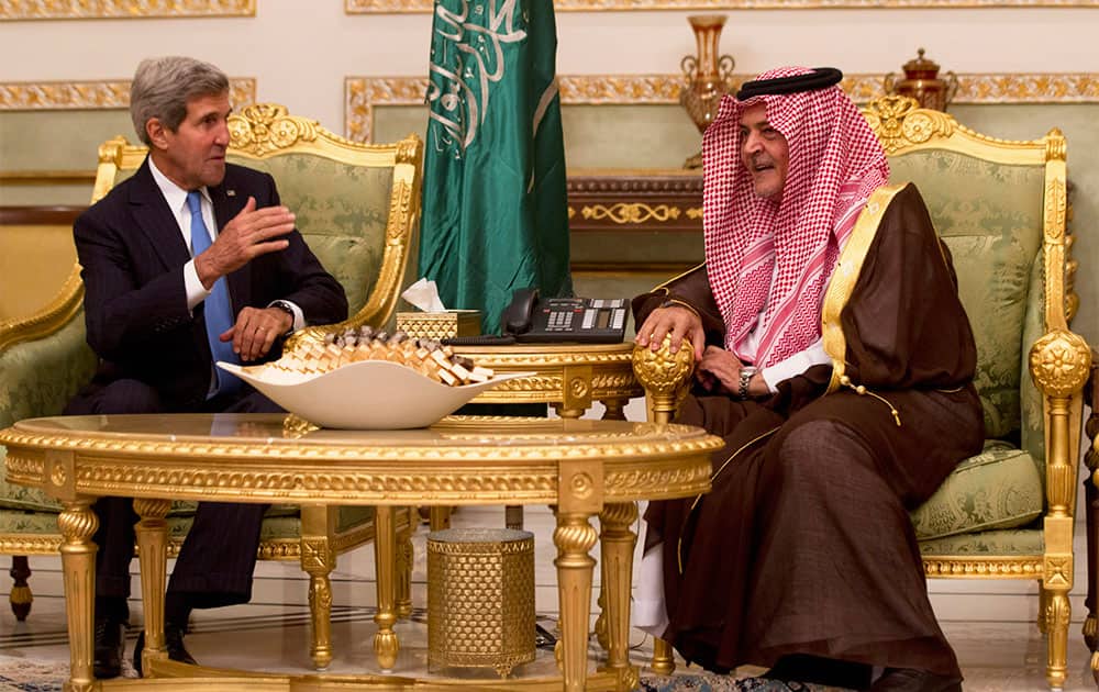 US Secretary of State John Kerry talks with Saudi Foreign Minister Prince Saud Al-Faisal bin Abdulaziz al-Saud, after Kerry arrived in Riyadh, Saudi Arabia.