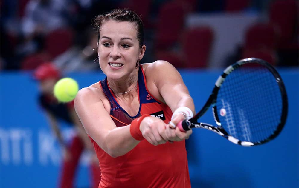 Anastasia Pavlyuchenkova of Russia returns a shot to Samantha Stosur of Australia during their semi-final tennis match of the WTA Tournament of the Champions in Sofia, Bulgaria.