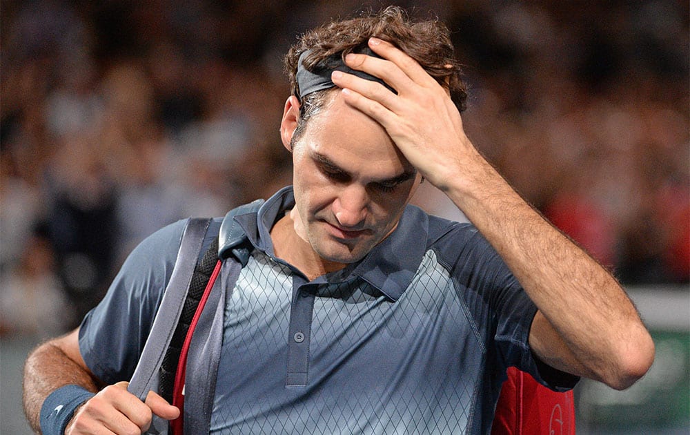 Switzerland`s Roger Federer leaves the stadium after losing his semifinal match against Serbia`s Novak Djokovic, at the Paris Masters tennis, in the Paris Bercy stadium.