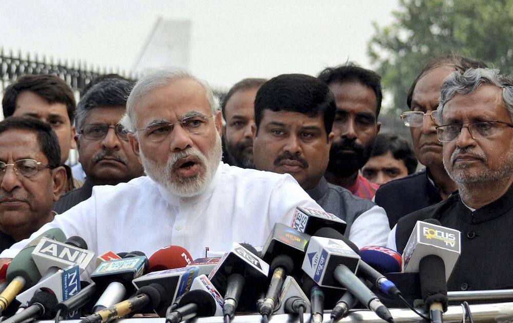 Gujarat Chief Minister and BJP`s Prime Ministerial candidate Narendra Modi with Sushil Kumar Modi and other party leaders addressing the media in Patna.