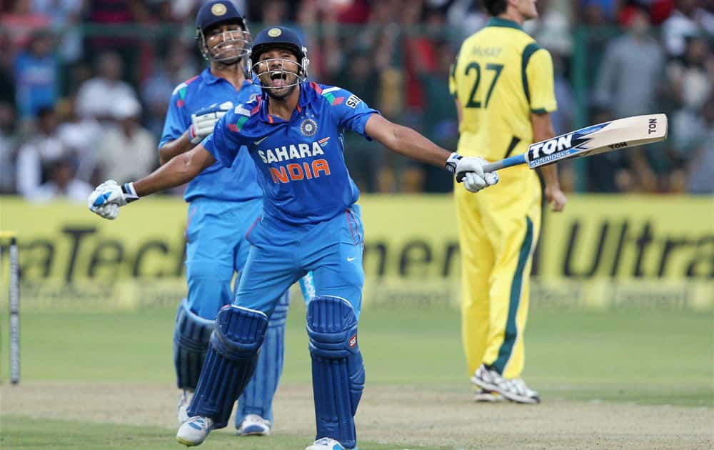 Rohit Sharma celebrates his double century during the 7th ODI cricket match against Australia at Chinnaswamy stadium in Bengaluru.