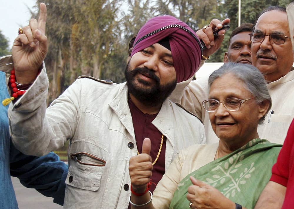 Delhi Chief Minister Sheila Dikshit and Punjabi pop singer Daler Mehndi at the launch of an election campaign DVD at her residence in New Delhi.
