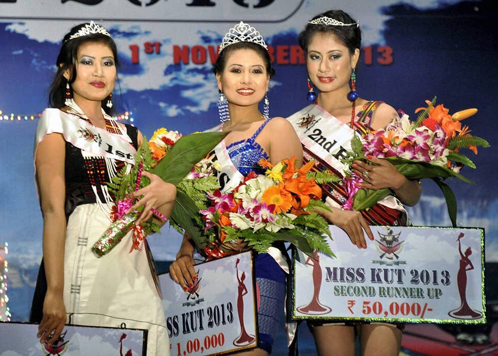 Miss Kut 2013 winners, from left 1st runner-up Salam Kalpana (L), winner Lingjanei Kipgen and 2nd runner-up Chakpram Purnima pose for photographs in Imphal.