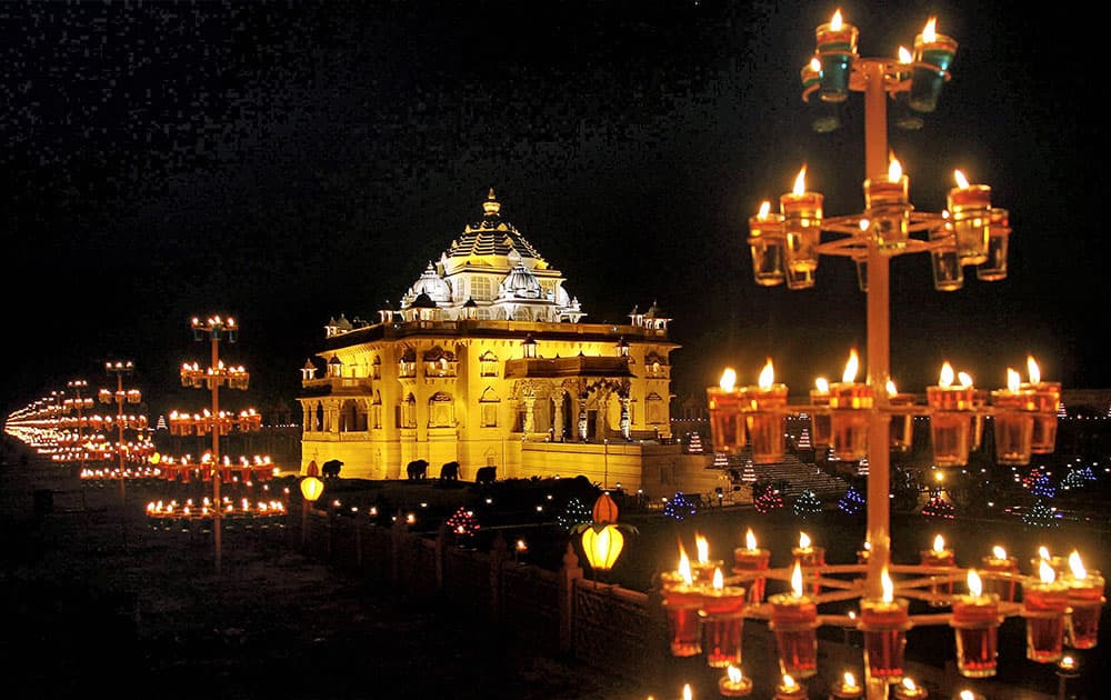 The Akshardham temple is illuminated with lamps and light during Diwali festival in Gandhinagar.