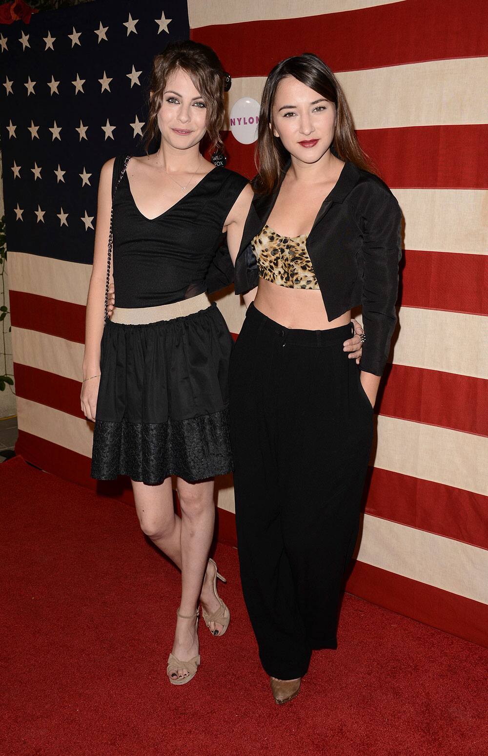 Actress Willa Holland, left, and actress Zelda Williams arrive at the NYLON November issue party at the Sunset Marquis hotel, in West Hollywood.