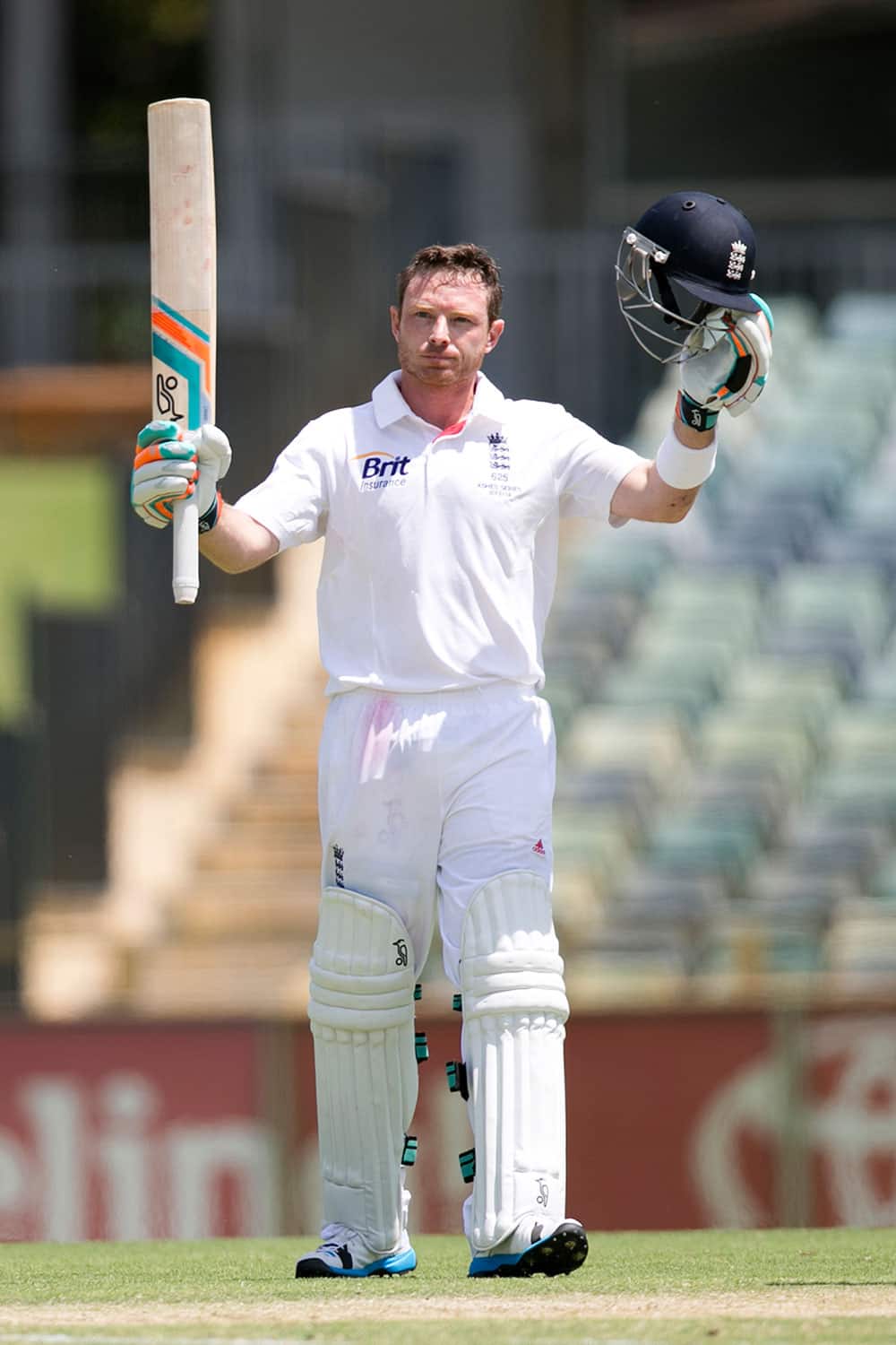 England`s Ian Bell celebrates after scoring his 100 in their tour cricket match against Western Australia Chairman`s XI in Perth, Australia.