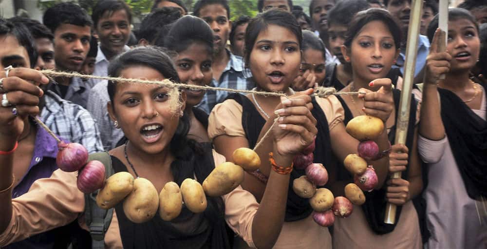 Activists of All Assam Students Union (AASU) taking out a rally protesting against the hike in the prices of onion, potato and other essential things in Guwahati.