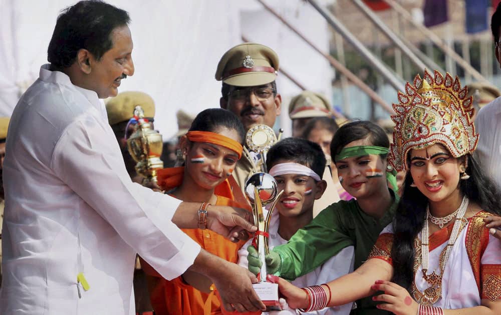 Chief Minister of AP N Kiran Kumar Reddy presenting awards to school children at a cultural programme held on the occasion of AP Formation Day in Hyderabad.