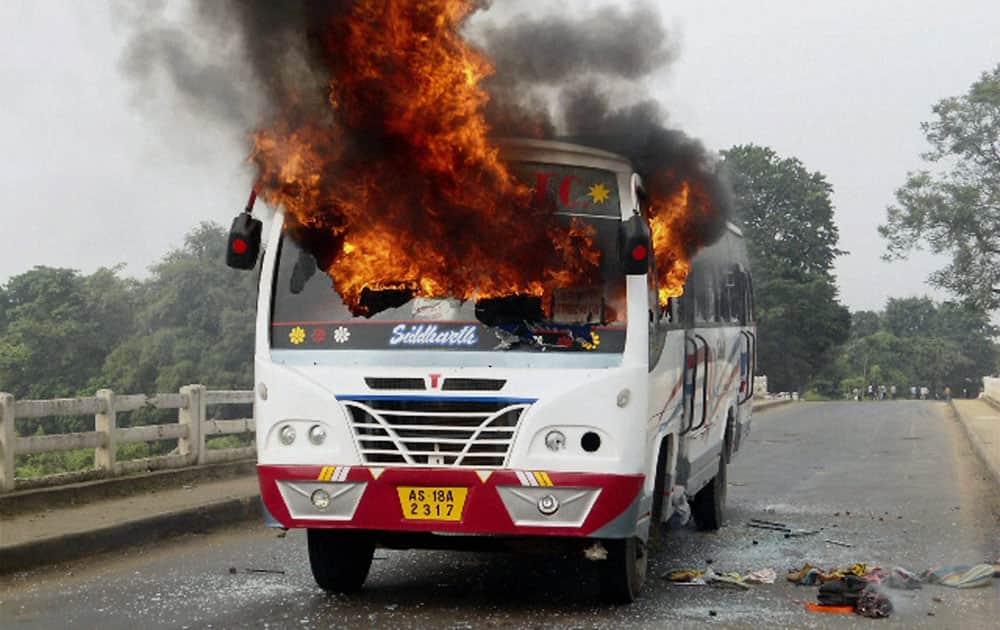 Protesters set ablaze a bus during a bandh called by non-Rabha organizations against proposed Rabha Hasong Autonomous Council elections in Krishnai, Assam.