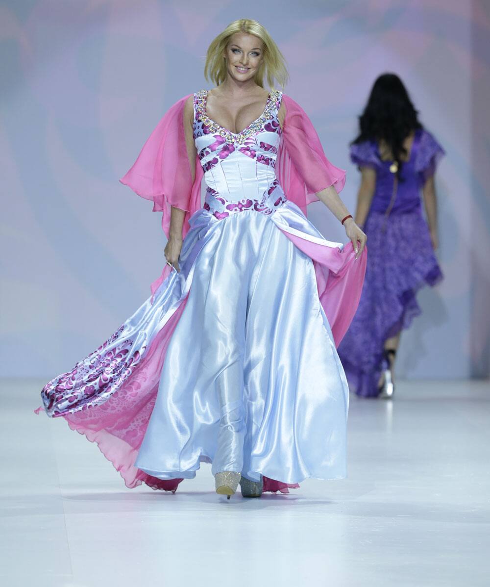 Former Bolshoi theater dancer Anastasia Volochkova displays a creation by Russian designers Yana and Anastasiya Shevchenko at the Moscow Fashion Week in Moscow.
