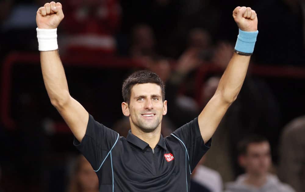 Novak Djokovic of Serbia acknowledges applause after defeating John Isner of the USA 6-7 (5), 6-1, 6-2 to reach the quarterfinals of the Paris Masters tennis tournament at Bercy Arena in Paris, France.