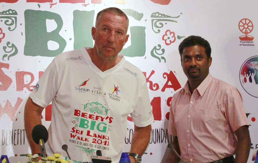 Former England`s cricketer Ian Botham, left and Sri Lankan spin bowler Muttiah Muralitharan arrive for a press conference to announce an event, called Beefy’s Big Walk in Colombo, Sri Lanka.