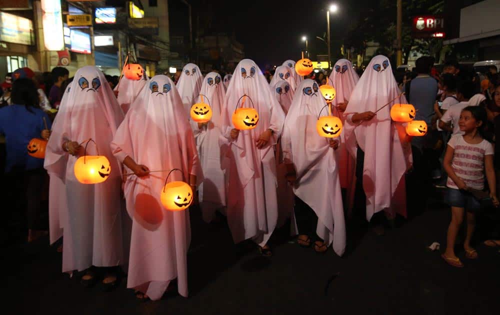Filipinos wear ghost costumes as they join a Halloween Parade in Marikina city, east of Manila.