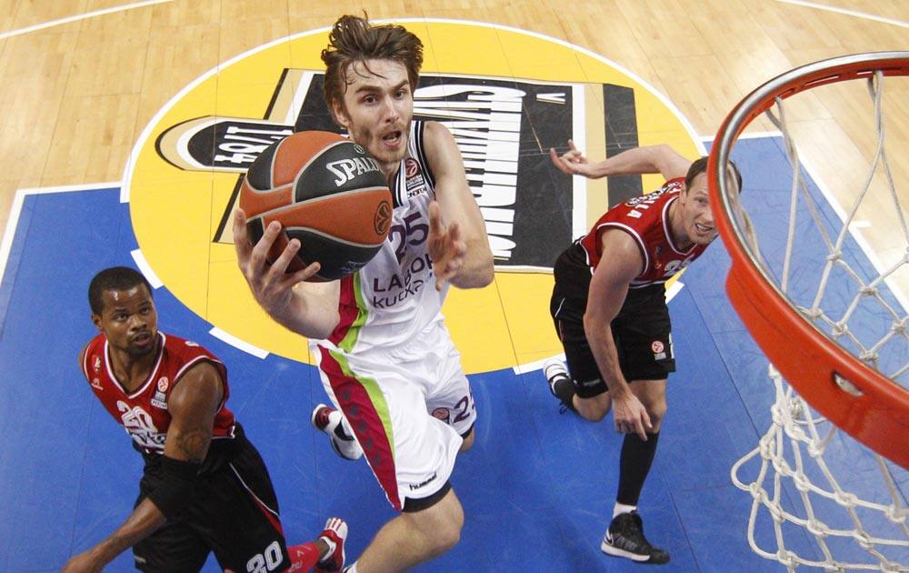 David Jalinek, center, of Spain`s BC Laboral Kutxa Vitoria, makes an attempt at the basket, during a Euroleague basketball match against Lithuania`s BC Lietuvos Rytas in Vilnius, Lithuania.