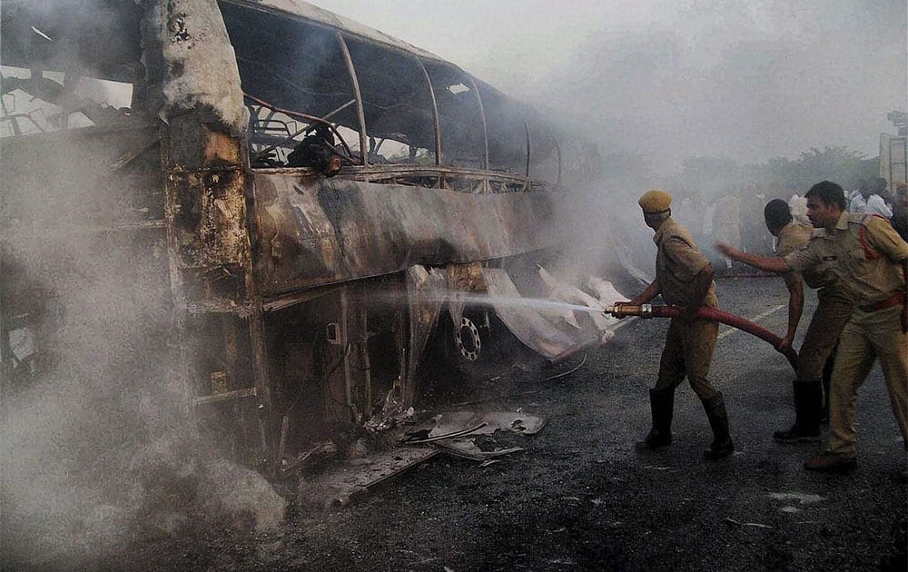 Firefighters trying to douse fire which engulfed a private bus coming to Hyderbad from Bangalore, near Mahabubnagar in Andhra Pradesh.