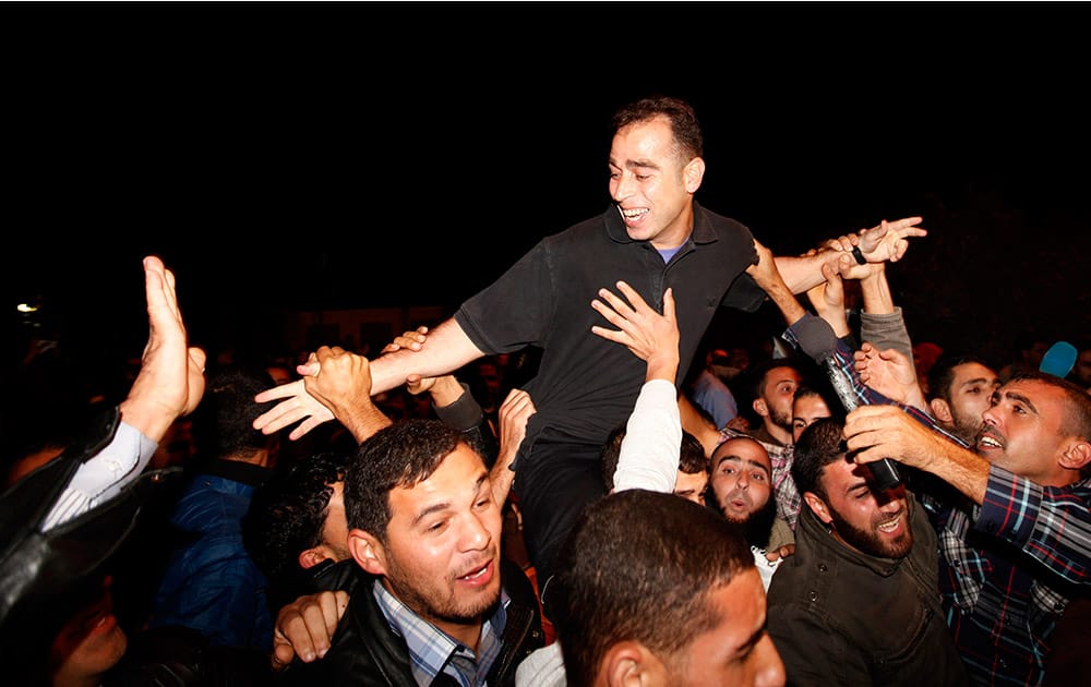 A released Palestinian prisoner, Hazem shber, arrives at a checkpoint at the entrance of Beit Hanoun between north of Gaza Strip and Israel.