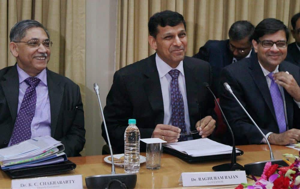 RBI Governor Raghuram Rajan (C) with Deputy Governors Urjit R Patel and K C Chakrabarty before the announcement of monetary policy in Mumbai.