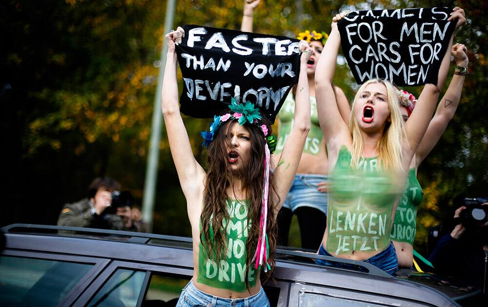 Femen activists protest against a ban on women driving in Saudi Arabia in front of the Saudi Arabian Embassy in Berlin.