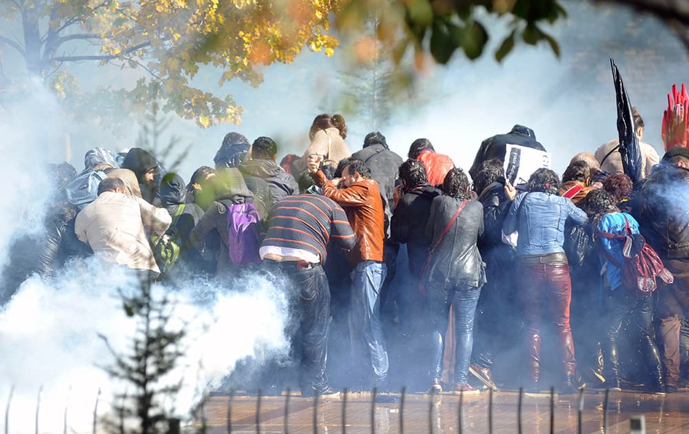 Riot police use teargas to disperse people gathered outside a courhouse during the trial of a police officer accused of killing Ethem Sarisuluk, a 26-year-old Turkish man, in an anti-government protest in June, in Ankara, Turkey.
