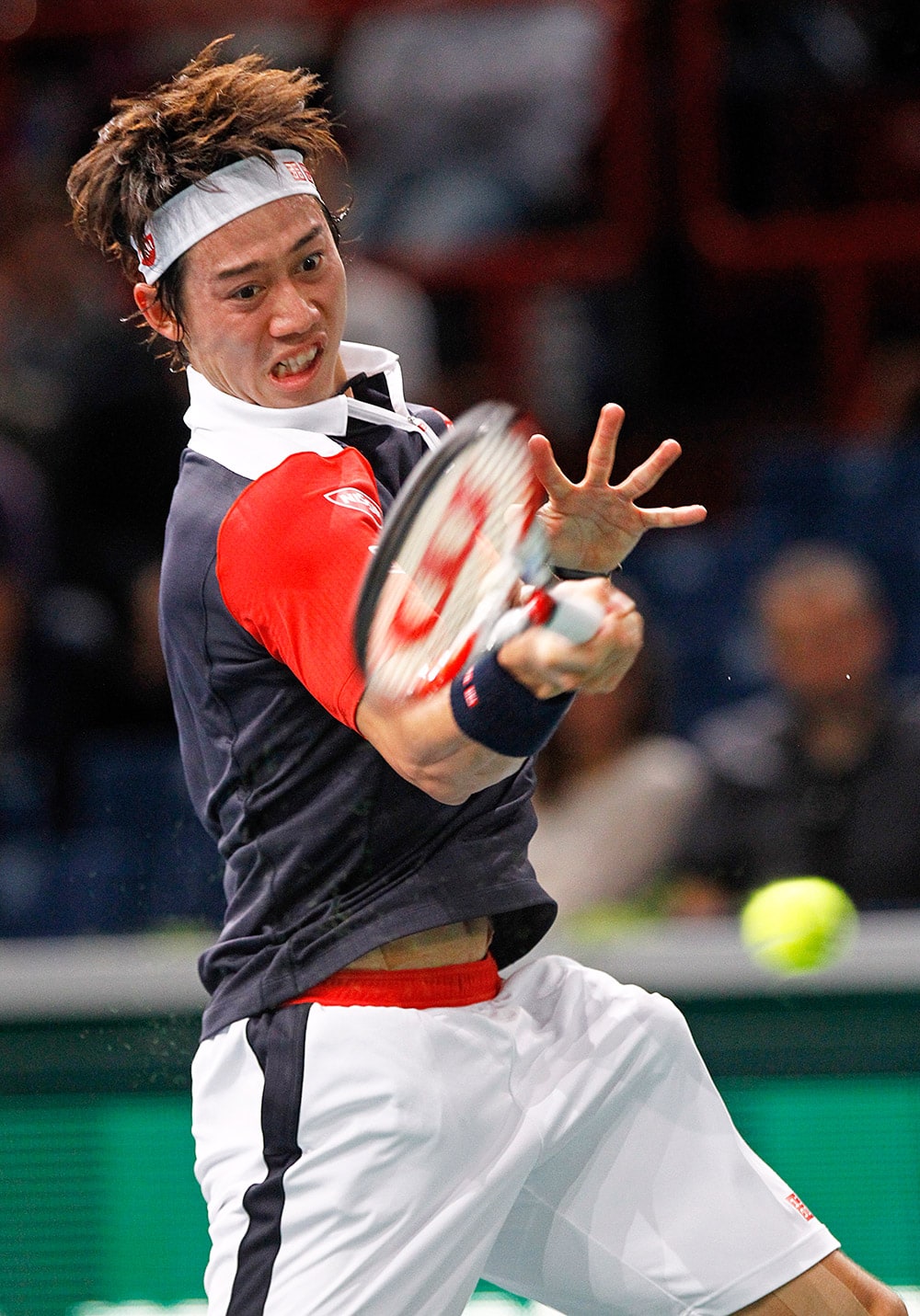 Japan`s Kei Nishikori returns the ball to France`s Julien Benneteau, during their first round match, at the BNP Masters tennis tournament, in the Paris.