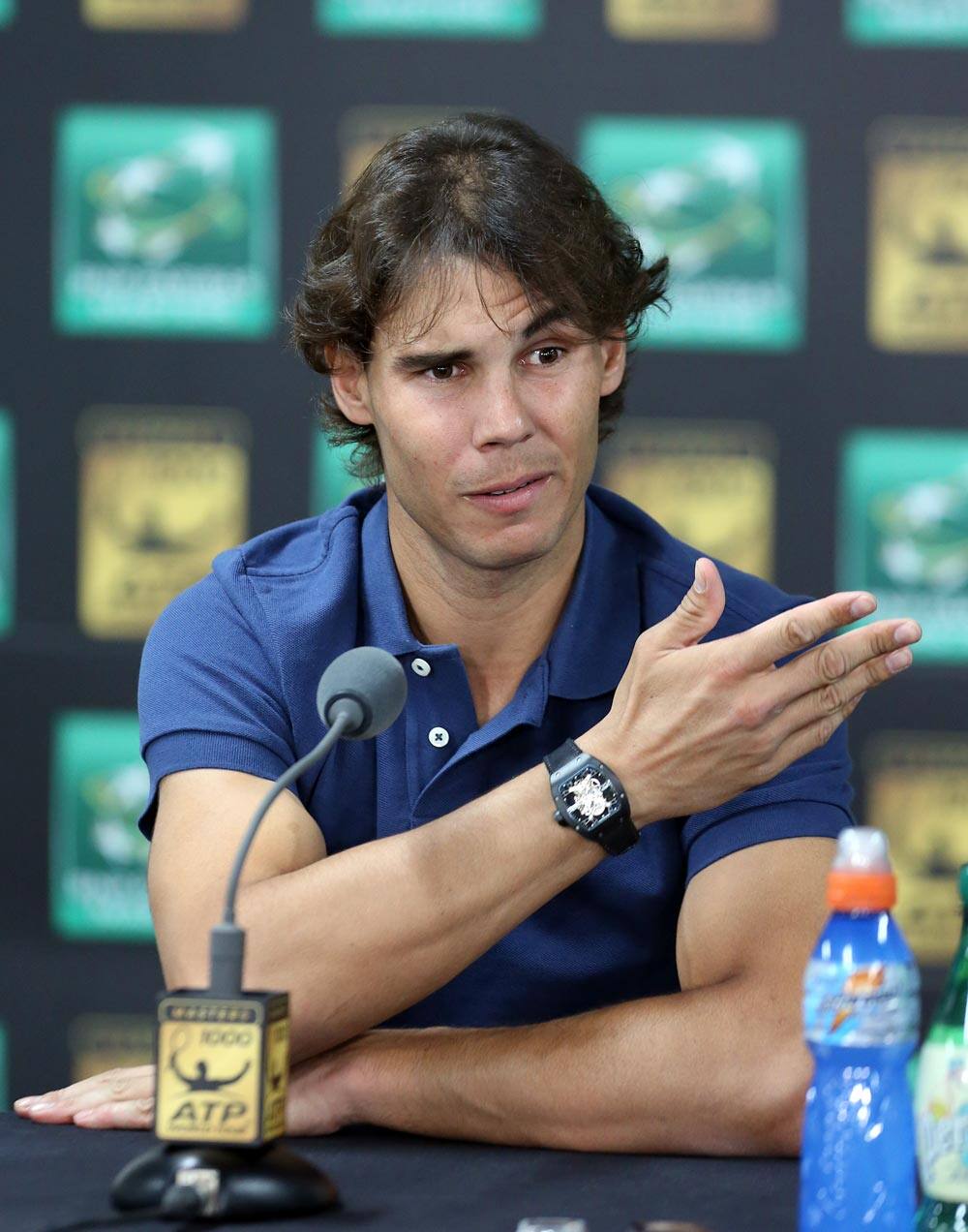 Spanish tennis champion Rafael Nadal gestures as he addresses reporters during a press conference at the BNP Masters tennis tournament, in the Paris Bercy stadium.