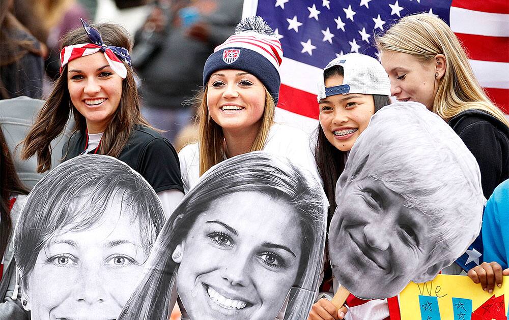 Alejandra Hinojosa, left, Meghan Willmes, center, and Izzy Reyes, right, wait for their favorite US Women`s National Team players before the start of a international friendly soccer match against New Zealand Women`s National Team in San Francisco. US won 4-1.