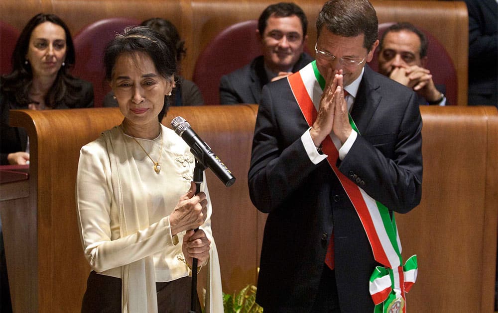Aung San Suu Kyi, Myanmar`s Nobel Peace Prize laureate and long-time political prisoner, speaks as Rome mayor Ignazio Marino looks at her, during a ceremony in which she received the honorary citizenship, in Rome.