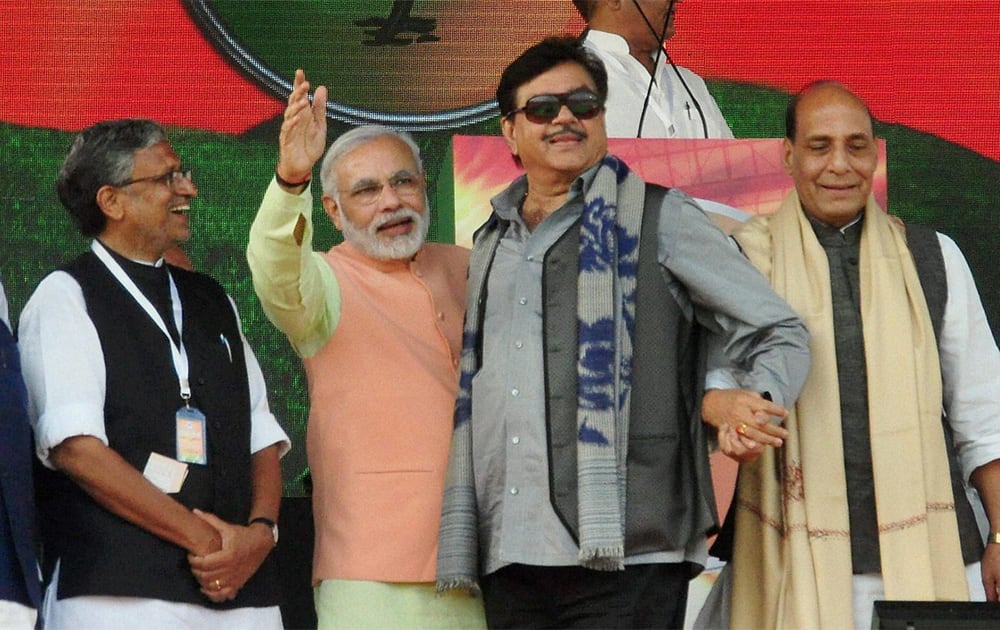 BJP president Rajnath Singh with Gujarat Chief Minister and BJP`s Prime Ministerial candidate Narendra Modi and party leaders Shatrughan Sinha and Sushil Kumar Modi at the Hunkar rally in Patna.