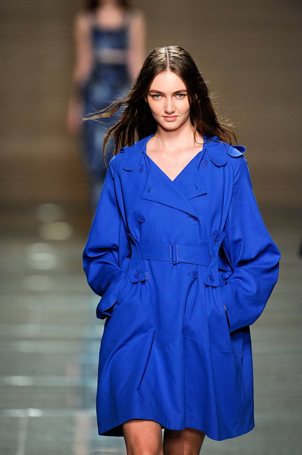 A model displays a creation by Portuguese designer Felipe Oliveira Baptista during the Portugal Fashion Spring/Summer 2014 week.