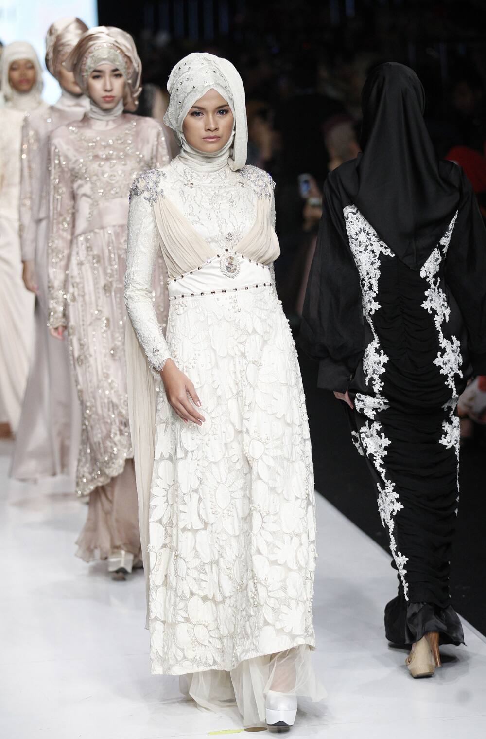 Models show creations by Indonesian designer Nabilla Ayumi at the Jakarta Fashion Week in Jakarta, Indonesia.