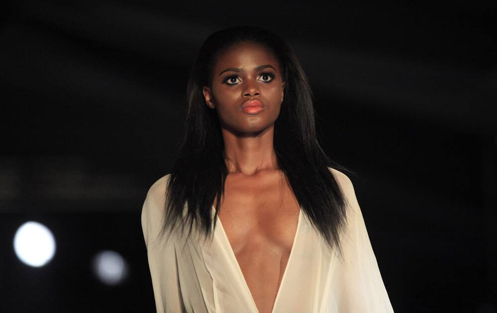 A model displays an outfit by designer Shola Ajayi, during the second day of Lagos Fashion and Design Week in Lagos, Nigeria.