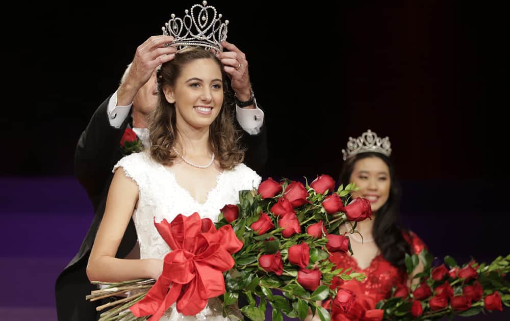 Ana Acosta is crowned Rose Queen as during the announcement and coronation of the 2014 Rose Queen ceremony in Pasadena, Calif.
