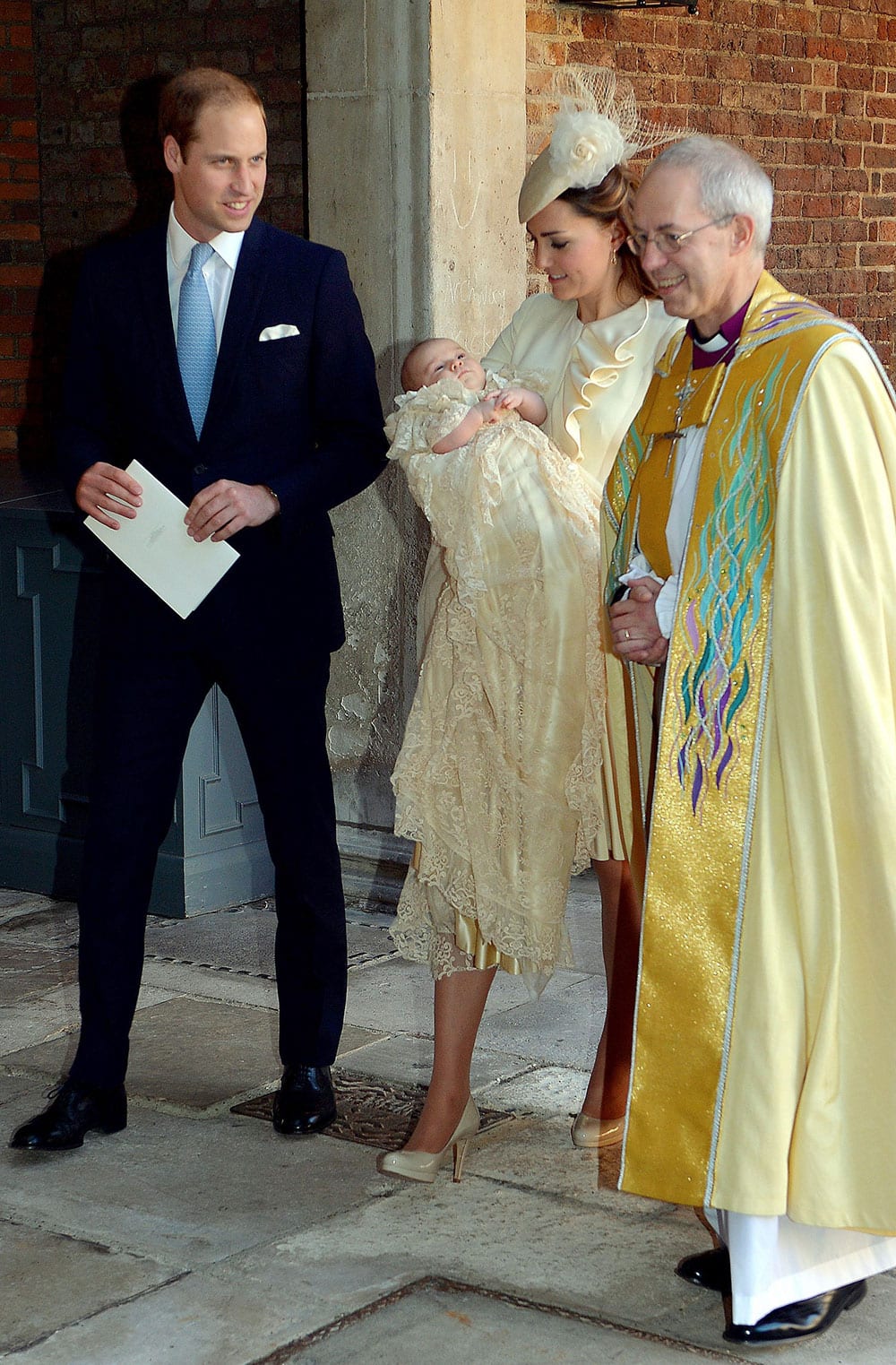 Britain`s Prince William, right, Kate Duchess of Cambridge with their son Prince George leave the Chapel Royal in St James`s Palace in London, with the Archbishop of Canterbury Justin Welby after the christening of the three month-old Prince George.