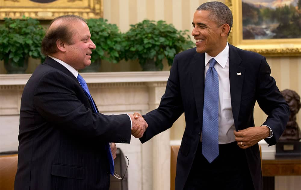 President Barack Obama shakes hands with Pakistan Prime Minister Nawaz Sharif at the conclusion of their meeting in the Oval Office of the White House in Washington.