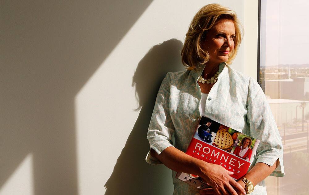 Ann Romney, poses with her bestselling cookbook, “The Romney Family Table: Sharing Home-Cooked Recipes & Favorite Traditions” in Phoenix.