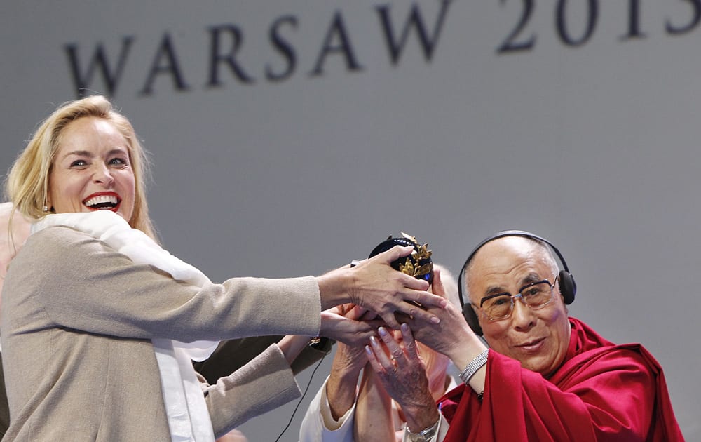 US actress Sharon Stone receives the Nobel Peace laureates summit Peace Prize from Dalai Lama in Warsaw, Poland.