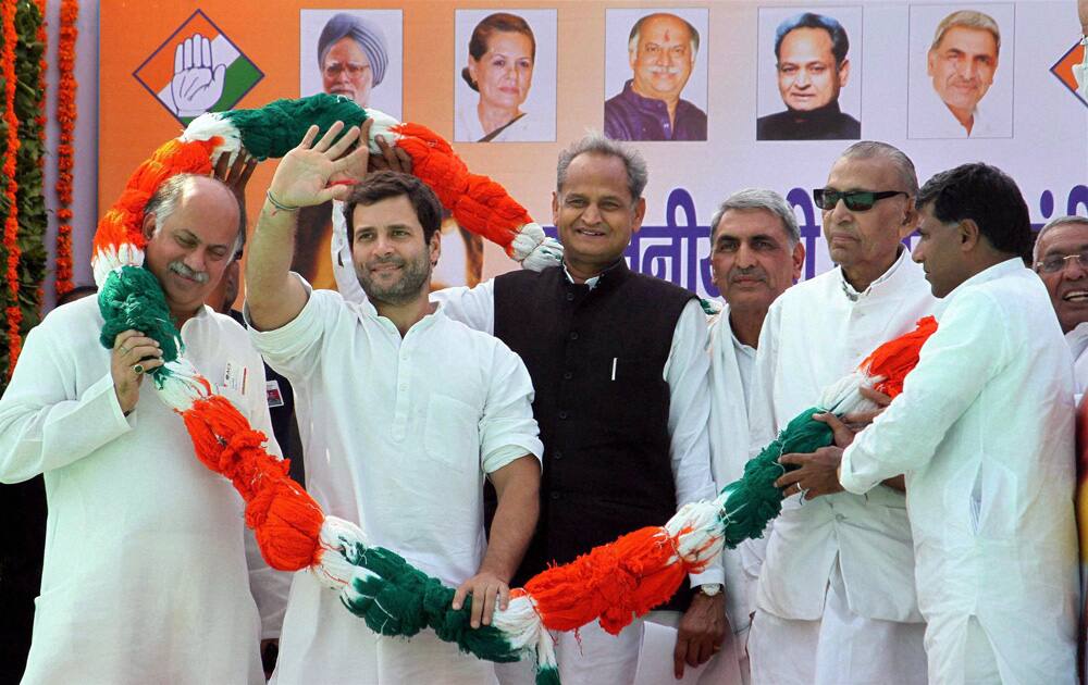 Congress Vice President Rahul Gandhi being garlanded along with Union minister Sis Ram Ola, Rajasthan Chief Minister Ashok Gehlot and other leaders, during a public meeting in Churu, Rajasthan.