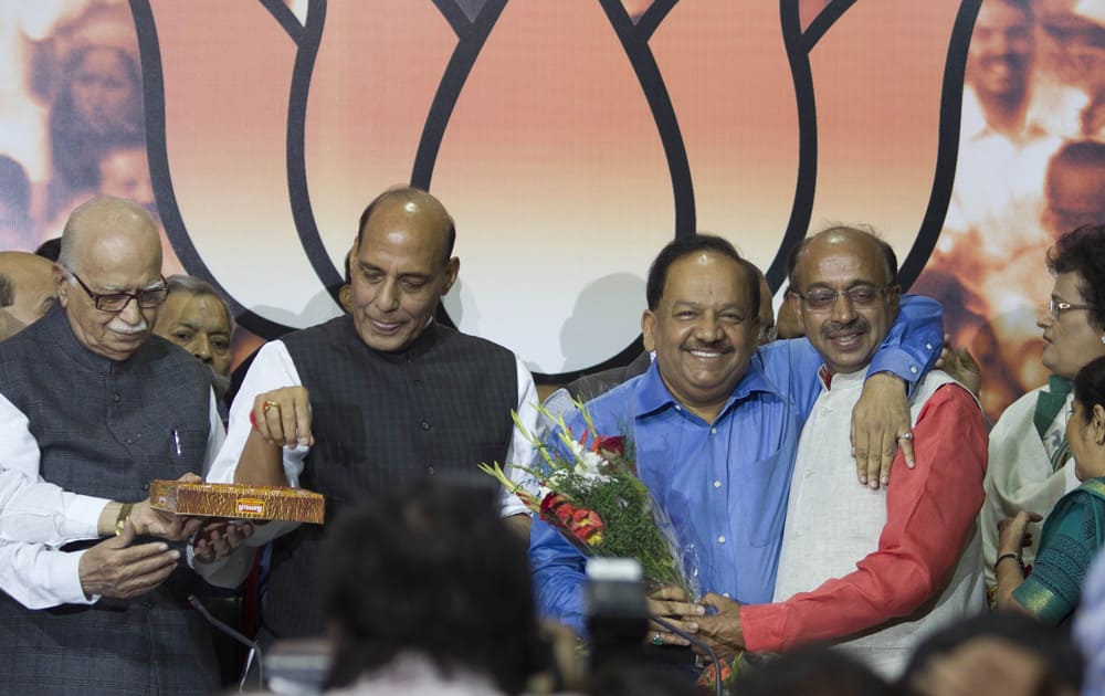 BJP`s chief ministerial candidate for the upcoming Delhi state elections Harsh Vardhan is greeted by BJP’s Delhi chief Vijay Goel after Vardhan’s candidature was announced in New Delhi.