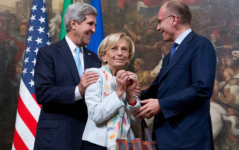 US Secretary of State John Kerry, Italian Foreign Minister Emma Bonino and Italian Premier Enrico Letta, pose for the media ahead of their meeting at Chigi Palace government office, in Rome.