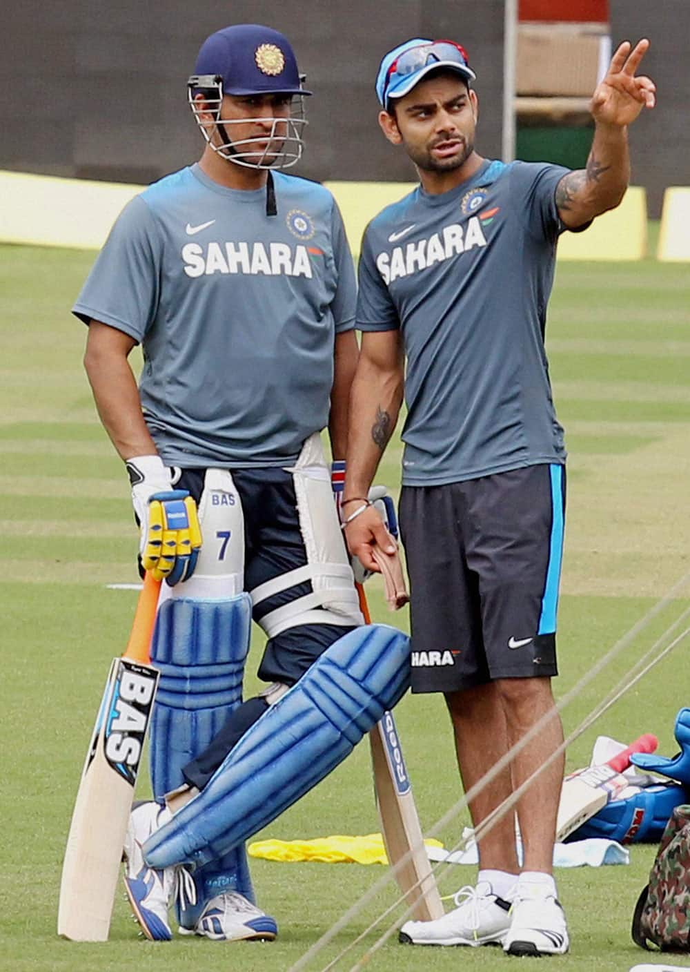 Indian captain M S Dhoni with Virat Kohli during a practice session in Ranchi on Tuesday ahead of the 4th ODI cricket match against Australia.