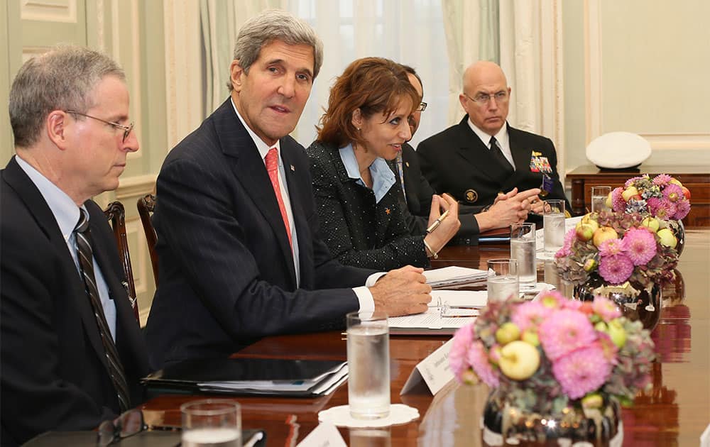 US Secretary of State John Kerry, second left, meets members of the Syrian opposition coalition, at the US Ambassador`s residence in London.