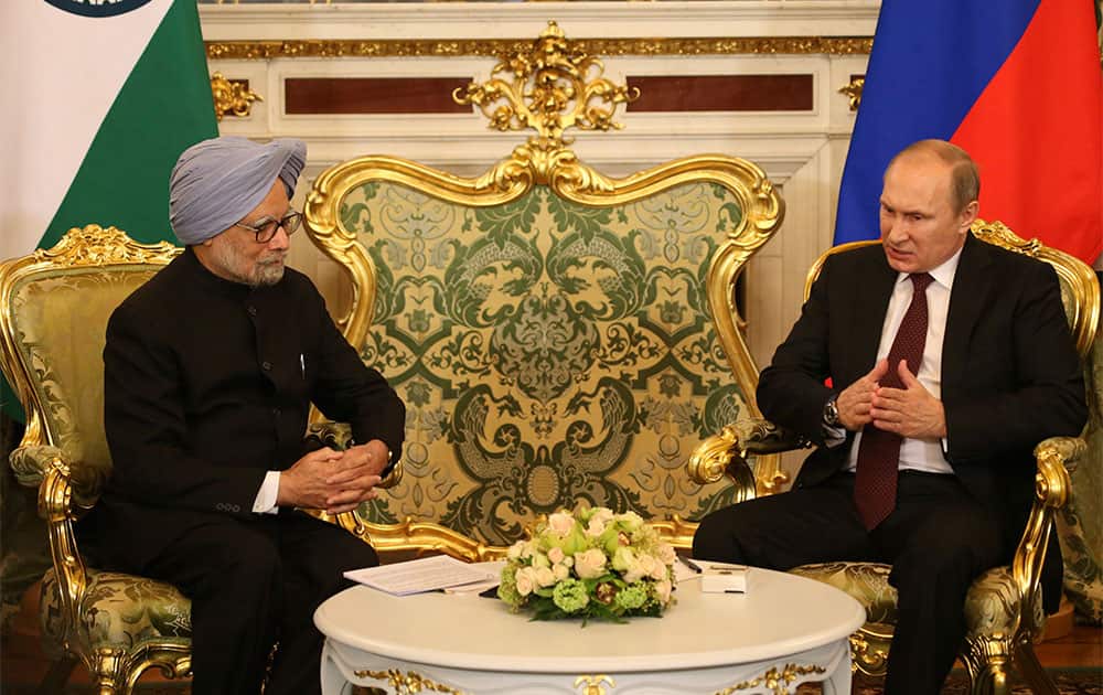 Prime Minister Manmohan Singh, left, listens to Russian President Vladimir Putin in Moscow. Manmohan Singh is in Russia on an official visit.
