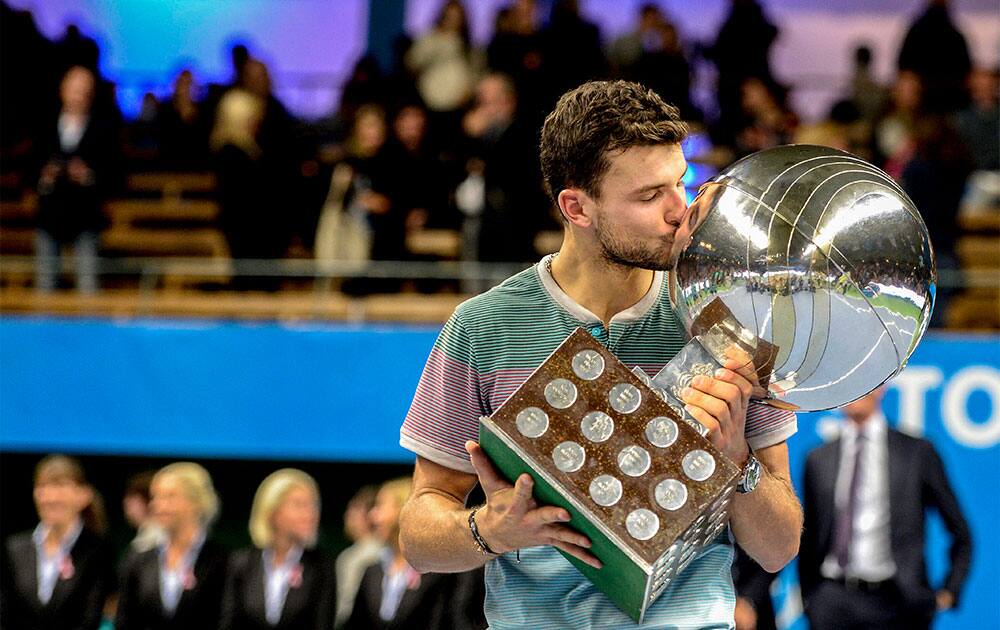 Bulgaria`s Grigor Dimitrov kisses his trophy after winning the ATP Stockholm Open tennis tournament at the Royal Lawn Tennis Club in Stockholm.