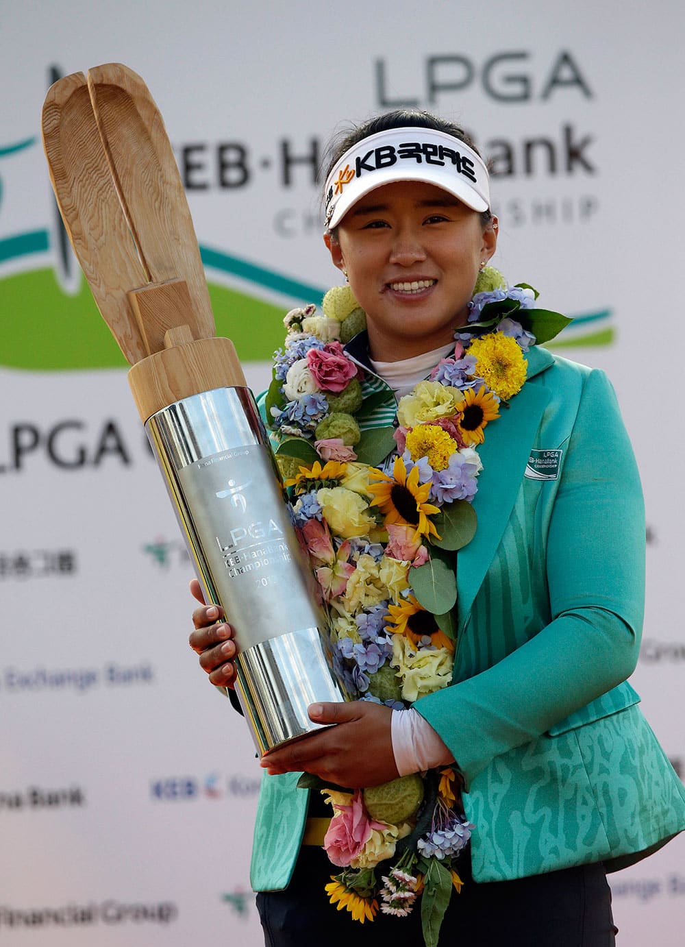 Amy Yang of South Korea poses with the trophy for the media after winning the KEB Hana Bank Championship golf tournament at Sky72 Golf Club in Incheon, west of Seoul, South Korea.