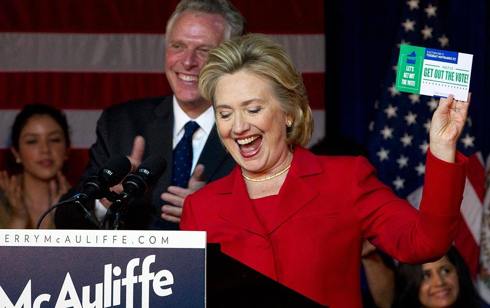 Former Secretary of State Hillary Rodham Clinton campaigns for Virginia gubernatorial candidate, Democrat Terry McAuliffe, centerleft, during a Women for Terry rally at the State Theater in Falls Church, Va.