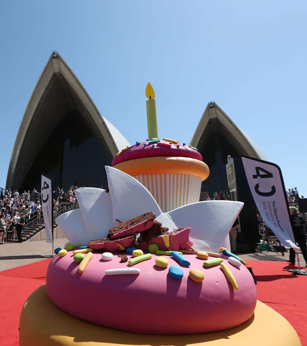 A real birthday cake sits in front of a huge decorative cupcake during celebrations for the Sydney Opera House`s 40th birthday in Sydney.