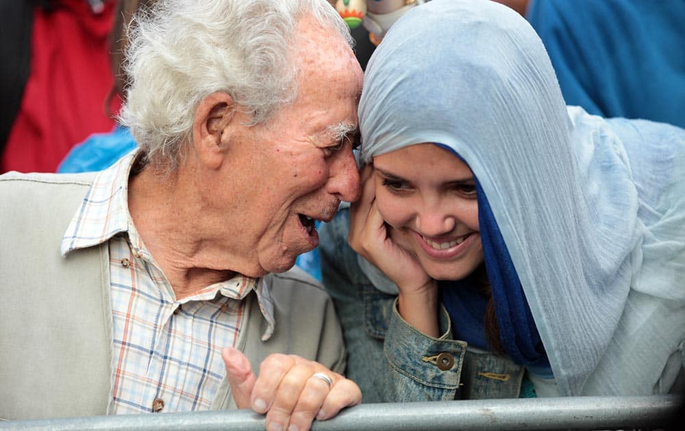 Protestors share a light moment during speeches in a demonstration called by Portugal`s main union CGTP, General Confederation of Portuguese Workers, against the government`s austerity measures in Lisbon.
