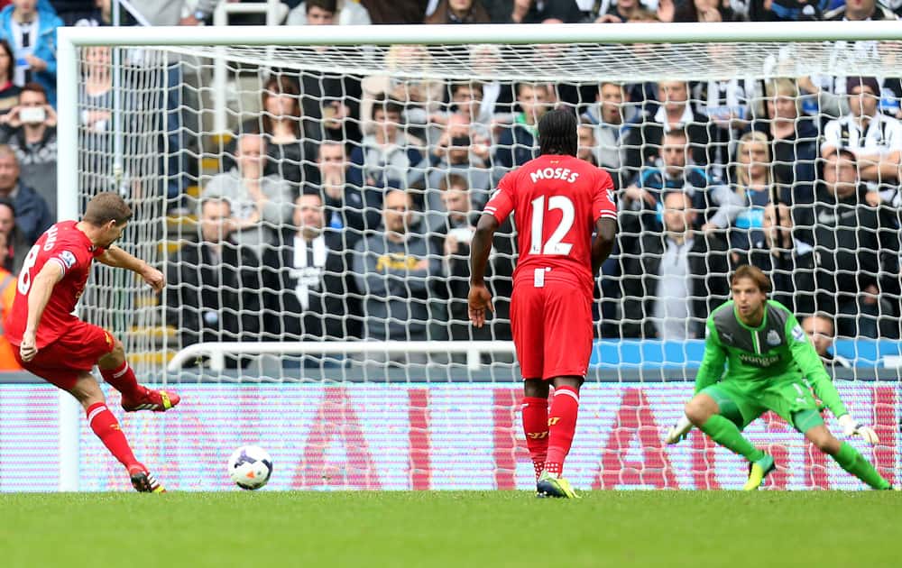 Liverpool`s captain Steven Gerrard scores his goal from a penalty kick past Newcastle United`s goalkeeper Tim Krul during their English Premier League soccer match at St James` Park, Newcastle, England.